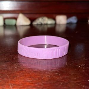 “We All Fit In” rubber band bracelet